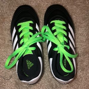 Green adidas sports cleats. No signs of usage.